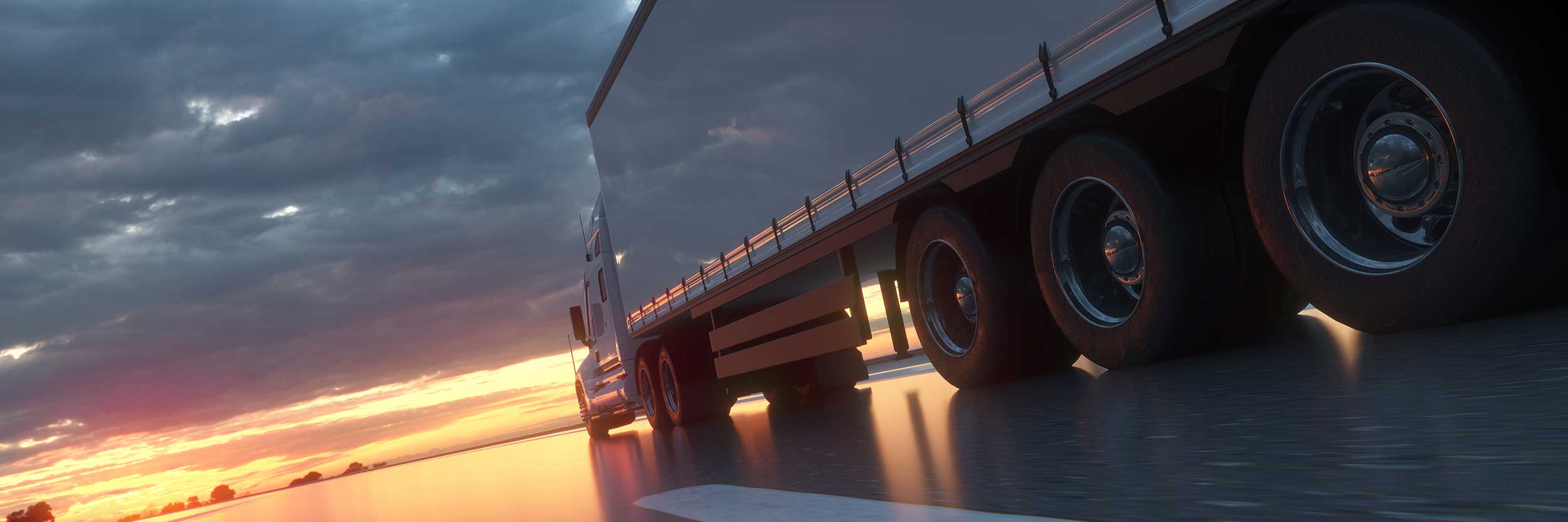 Semi truck heading into the sunset